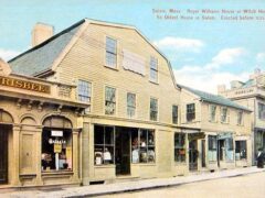 Postcard of the Salem Witch House, with the plumbing shop, laundromat and shoe shop next door, Salem, Mass, in 1910