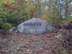 Babson Boulder inscribed with the word "Kindness" in Dogtown in Gloucester, Mass, circa 2012. Photo by Rebecca Beatrice Brooks.